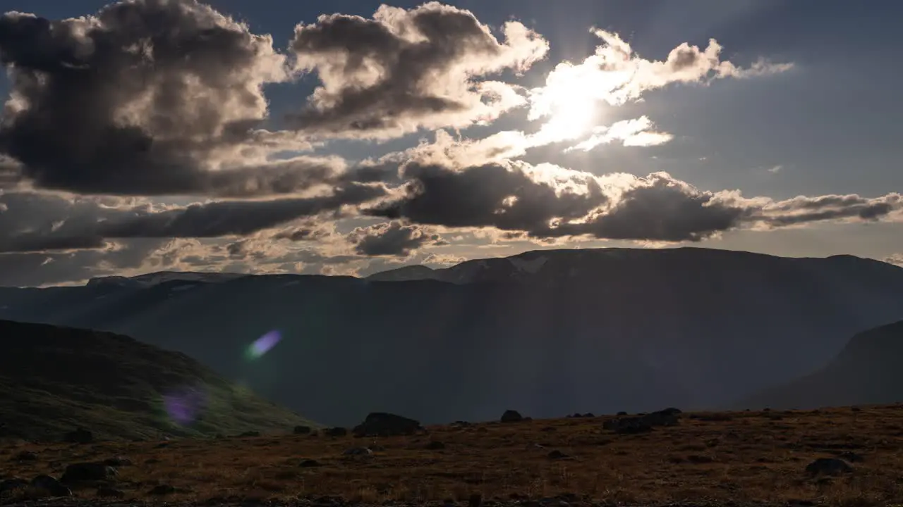 Sunstar peaking thourhg the stormy clouds dark