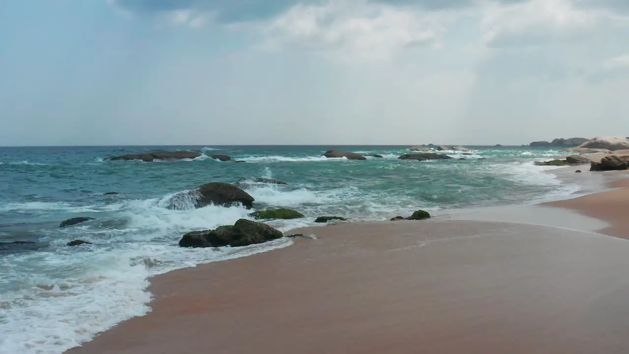 Wave crushing rocks on the coast of Yala Sri Lanka  India Ocean seascape