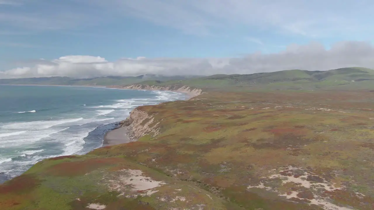 Low aerial shot flying fast over California coastal cliffs