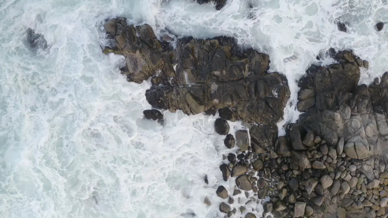 4K overhead tracking shot of heavy surf on California coast