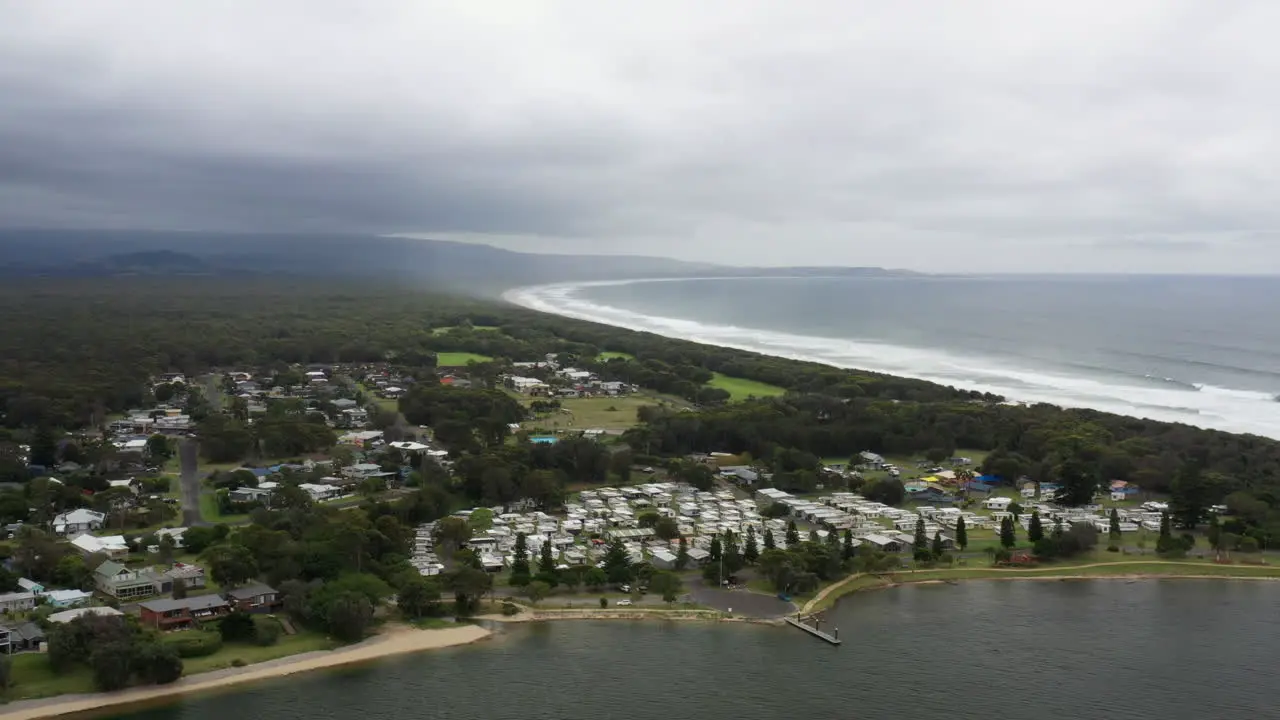 Aerial drone shot around Shoalhaven heads and caravan park on a stormy day in south coast NSW Australia