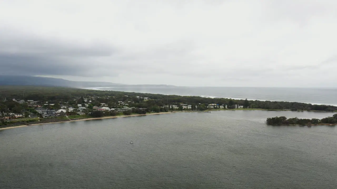 Aerial drone shot towards Shoalhaven heads on a stormy day in south coast NSW Australia