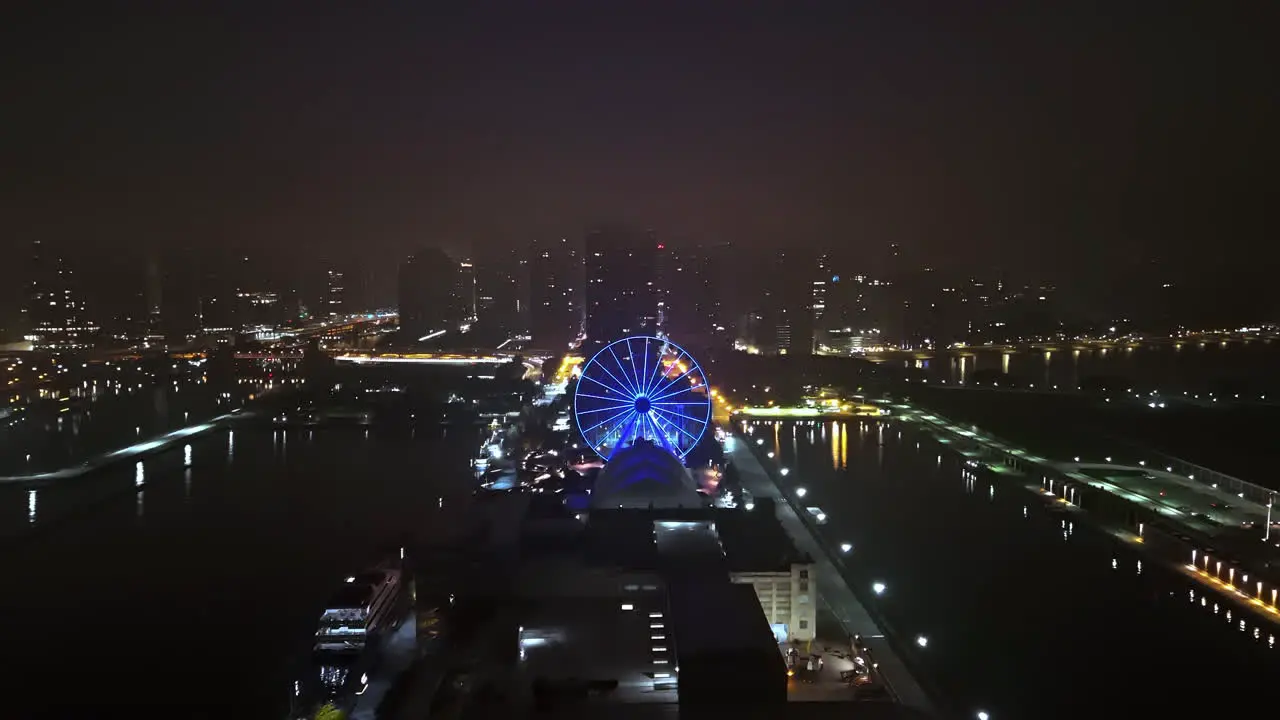 Aerial view backwards over the fog covered Navy pier calm evening in Chicago