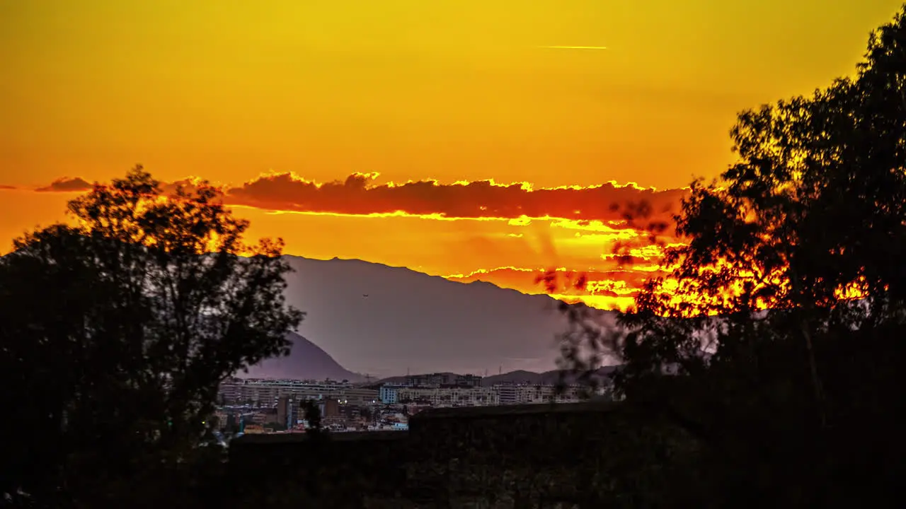 Port of Malaga during a golden sunset time lapse