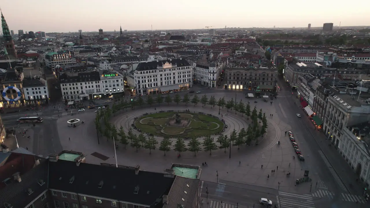 Overhead View of Kongens Nytorv and Nyhavn at Night Bustling with People and Enlivened by the Nighttime City Lights