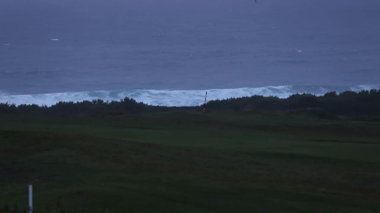 Static shot of large swells crashing on Fistral beach during High tide Newquay