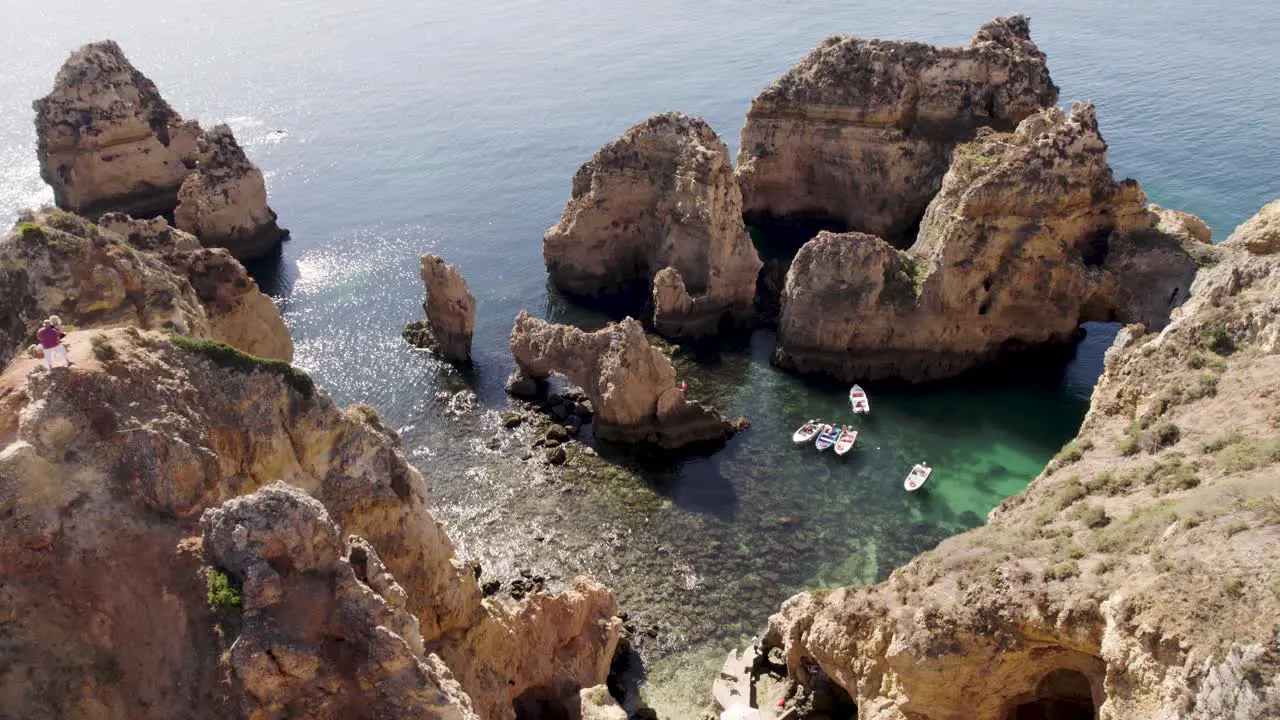 Visitors taking photos on top of cliff Lagos  Algarve