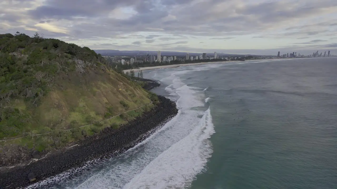 Rolling Waves Onto Burleigh Heads Beach On A Cloudy Day In Gold Coast Australia aerial shot