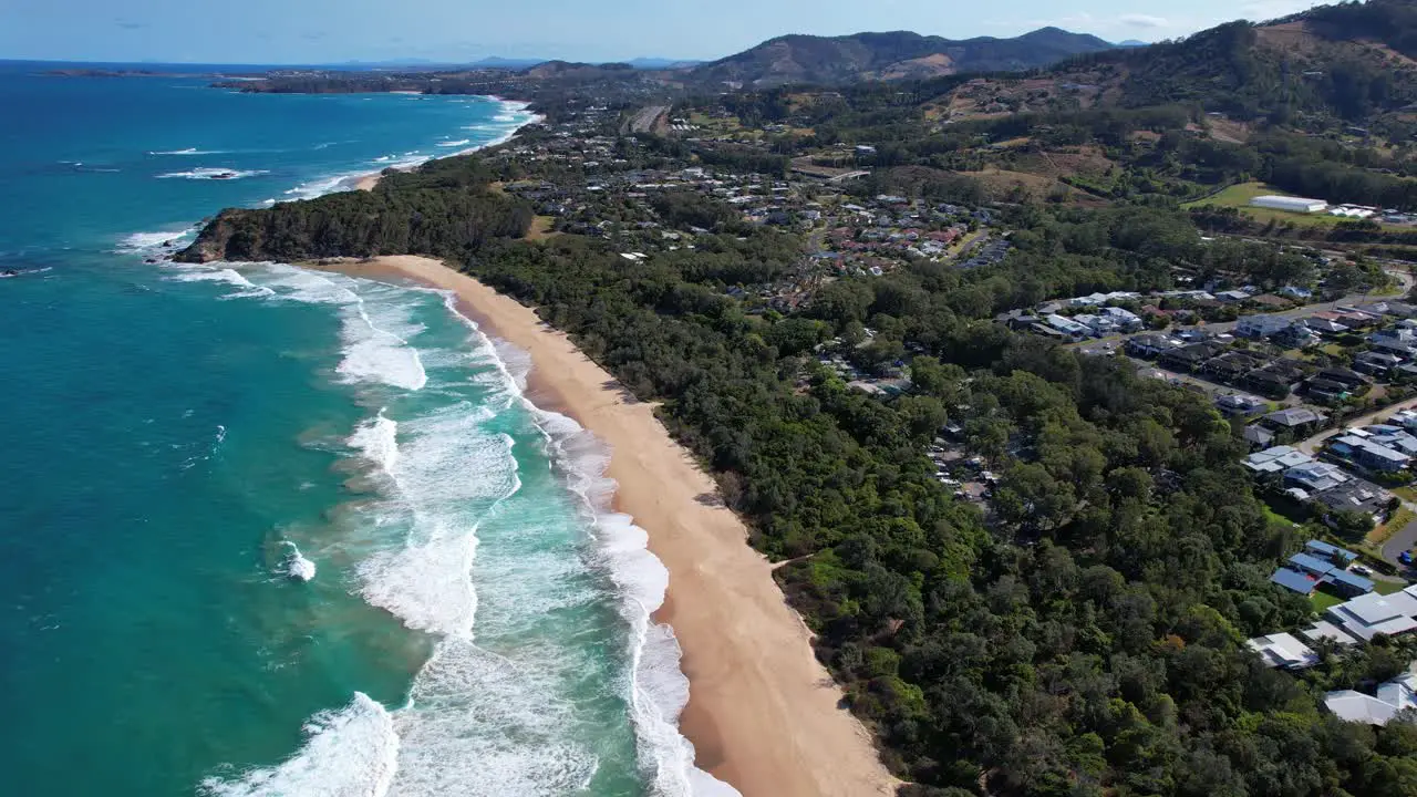 Sapphire Beach With Foamy Waves Splashing On Sandy Shore In NSW Australia aerial shot