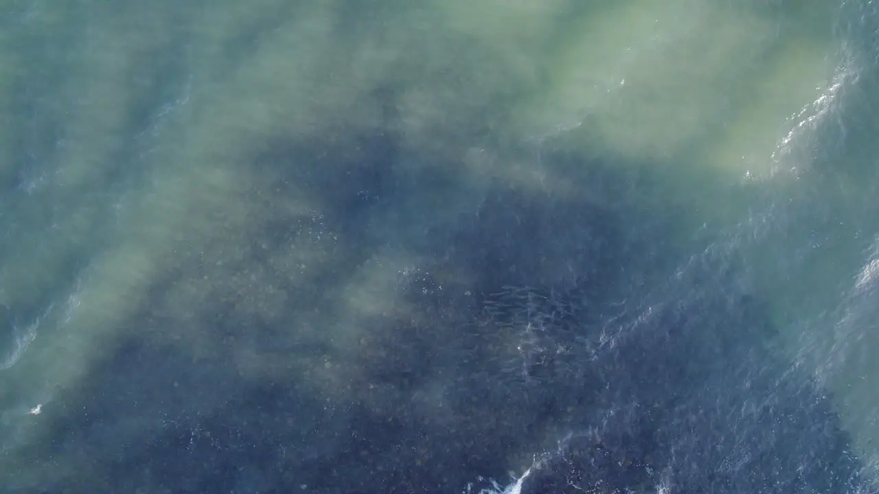 Overhead Shot Of Clear Blue Sea With Waves Splashing In Tropical North Queensland In Australia