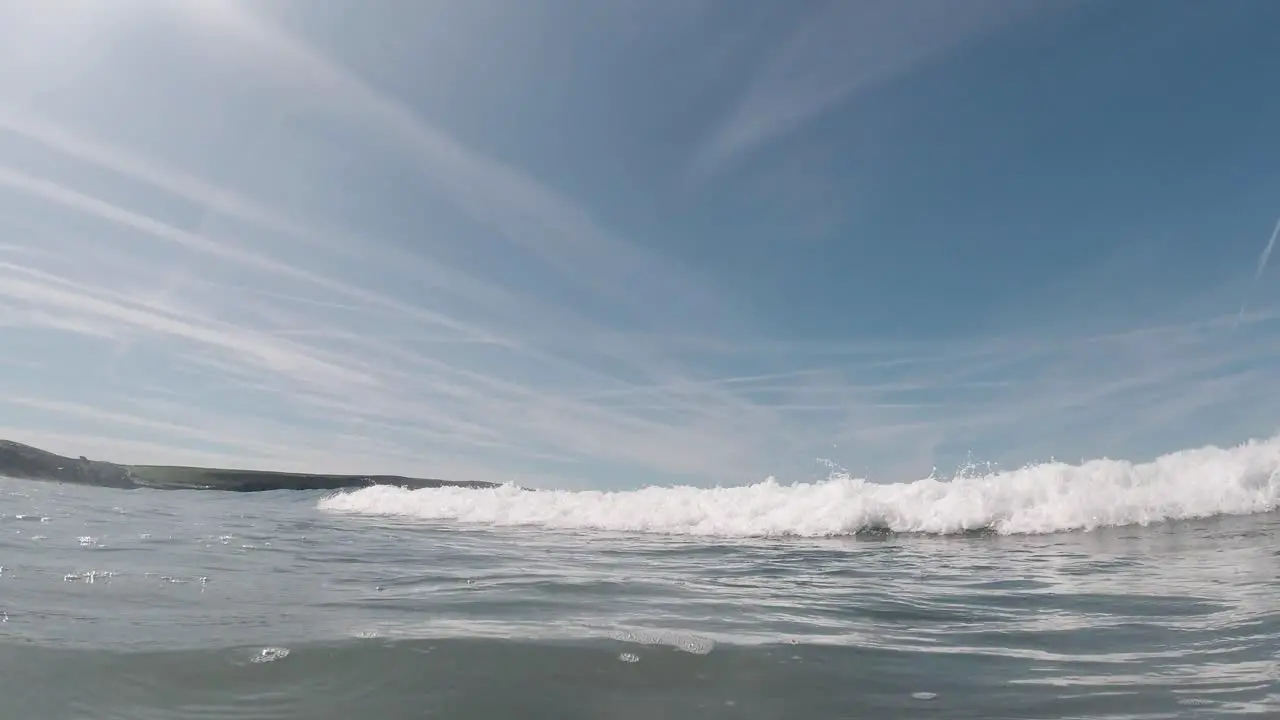 Slow Motion Sea Waves Hitting Camera on Hot Sunny Day