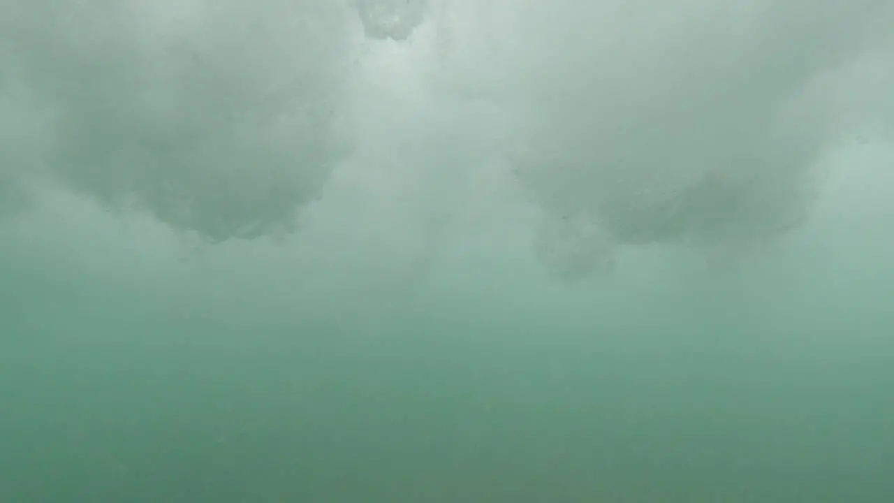 Underwater Perspective Below Strong Breaking Surf Waves