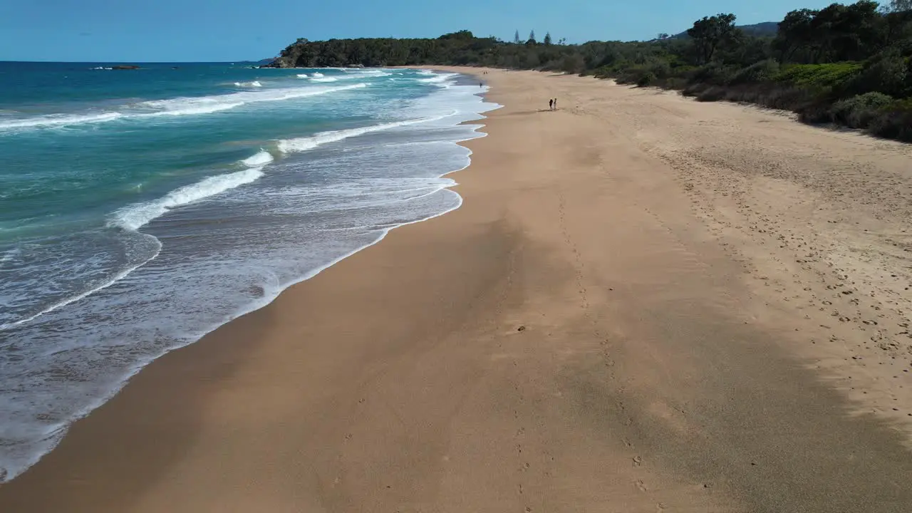 Ocean Waves And Sandy Shore Of Sapphire Beach In New South Wales Australia drone shot