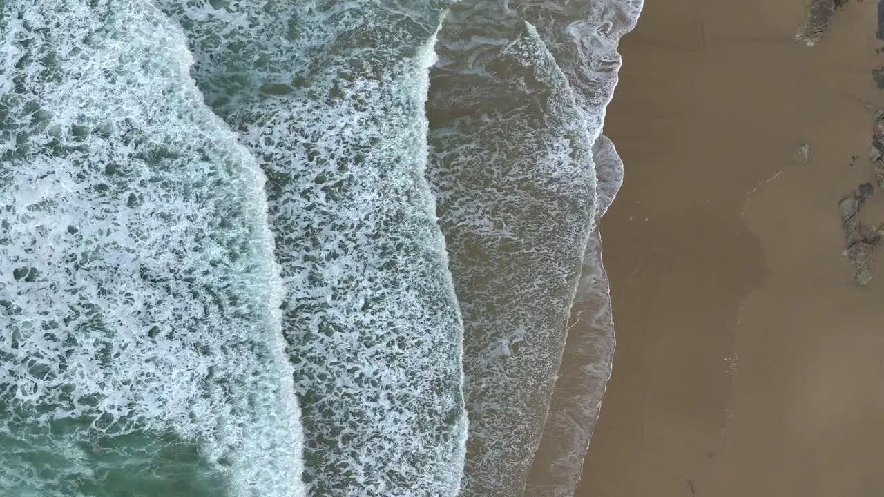 Waves Rolling On Sandy Beach In Slow Motion Aerial Drone