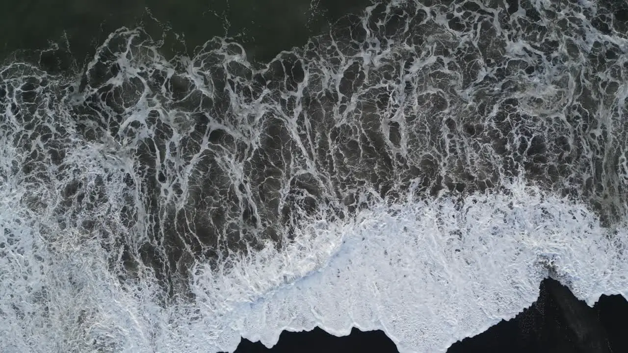 Top down shot of waves crashing in the south of Bali aerial