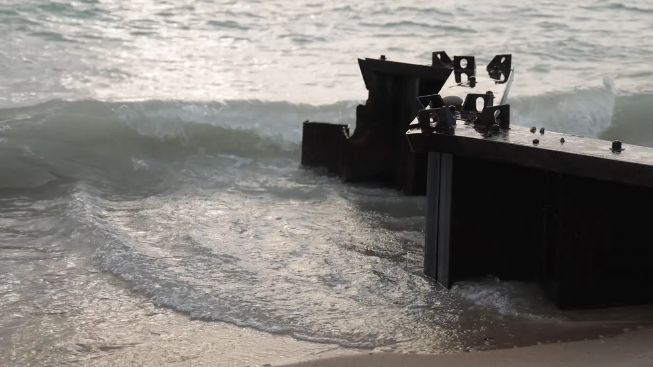 Waves crashing on breakers in Lake Michigan located in Frankfort Michigan with stable close up