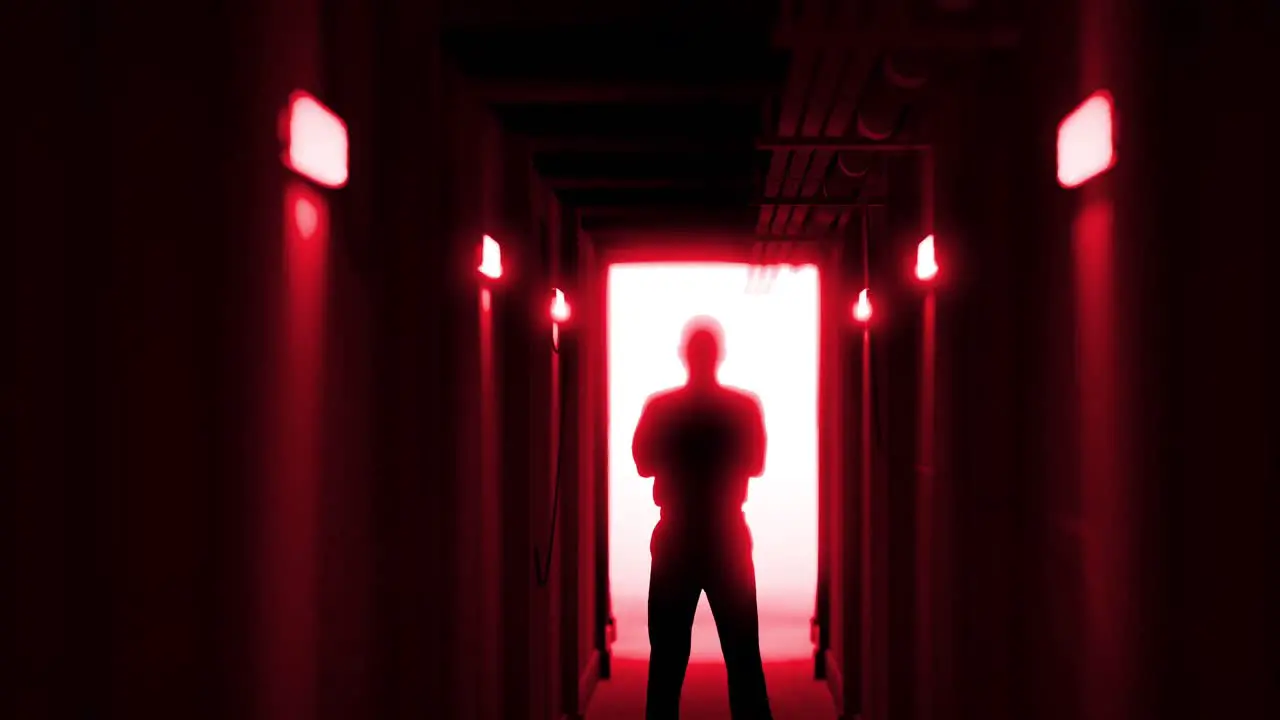 Animation of man silhouette standing in dark corridor