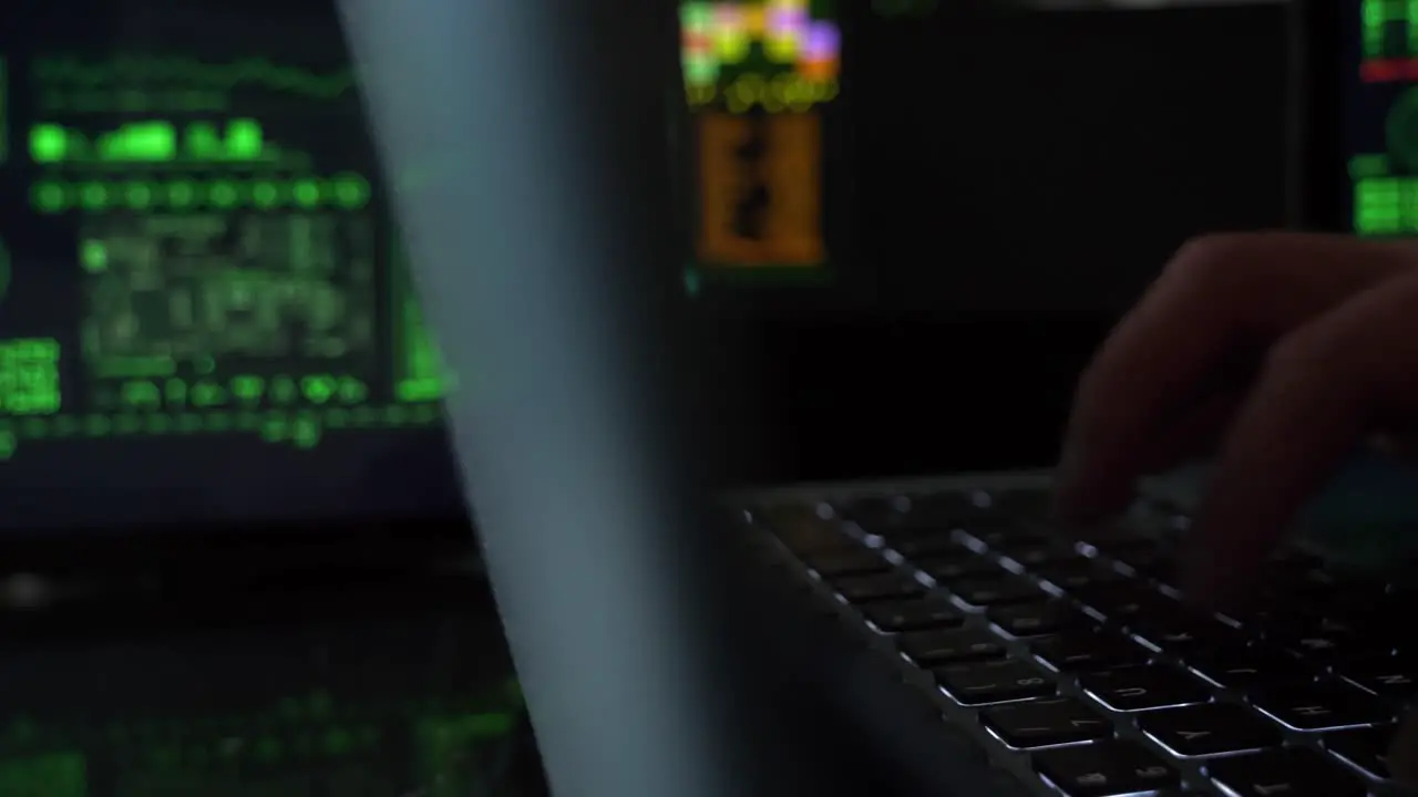 person typing in a technology center on a laptop slider reveal close-up