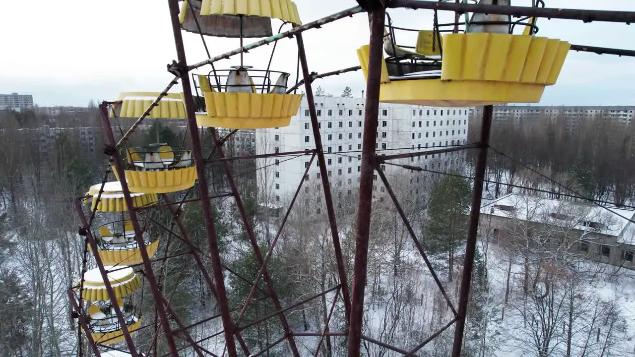 Abandoned Pripyat city and rusty Ferris wheel in winter Chernobyl