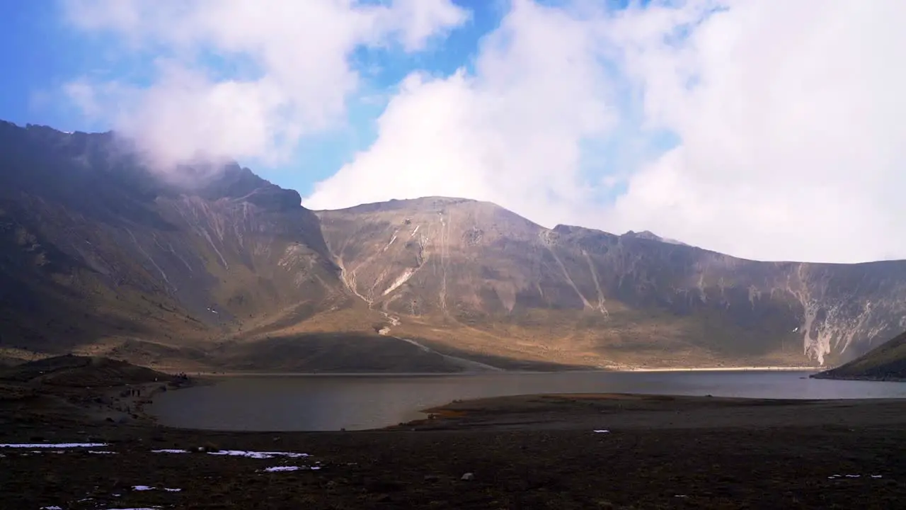 Panoramic view of the moon lagoon in nevado de toluca crater at sunset with a nice view of the shadows and a little bit of snow