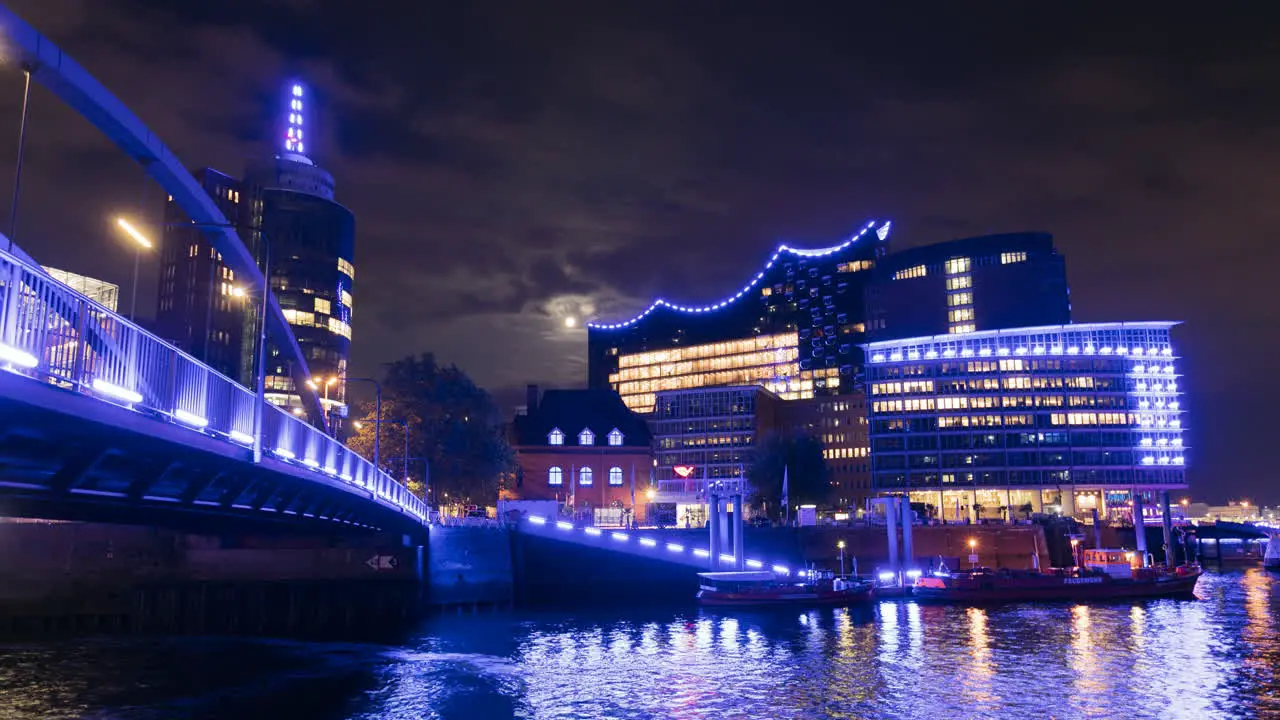 Twilight timelapse harbour Hamburg Full moon above Elbphilharmonie