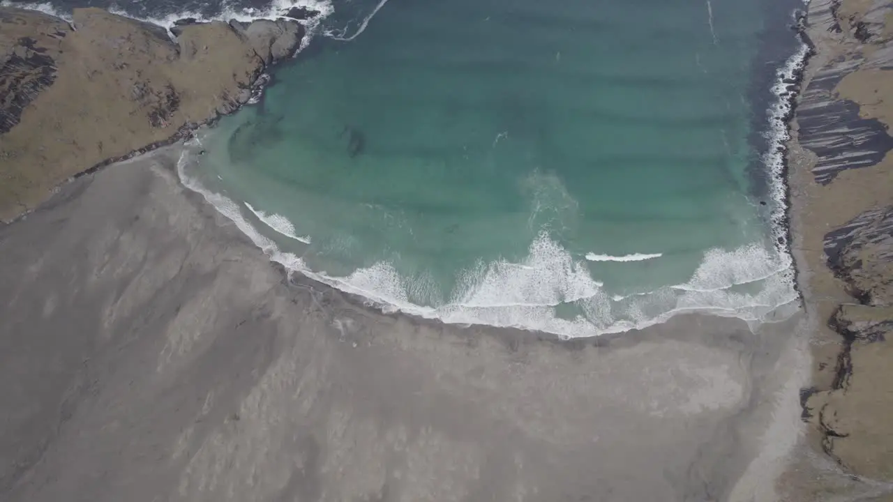 Aerial view towards the Bunes beach dark autumn day in Lofoten Norway tilt drone shot