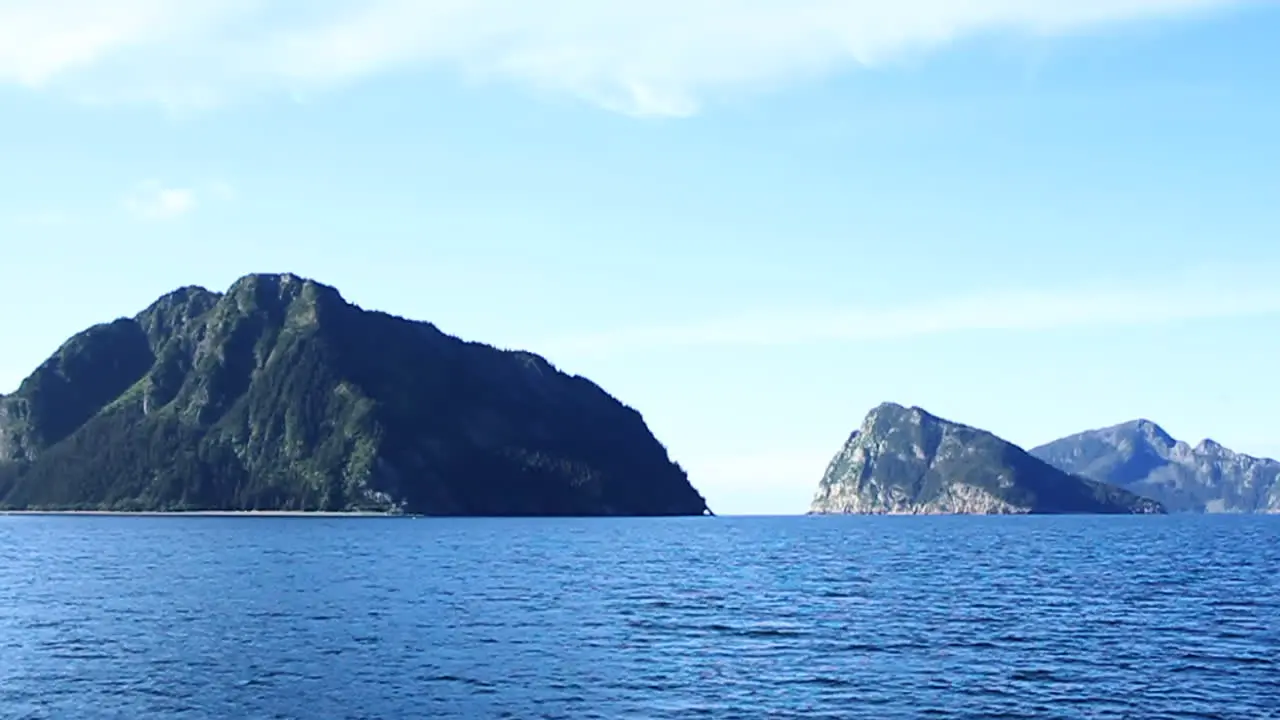 Waves Ripple in Lake with Mountains in Background in Alaska