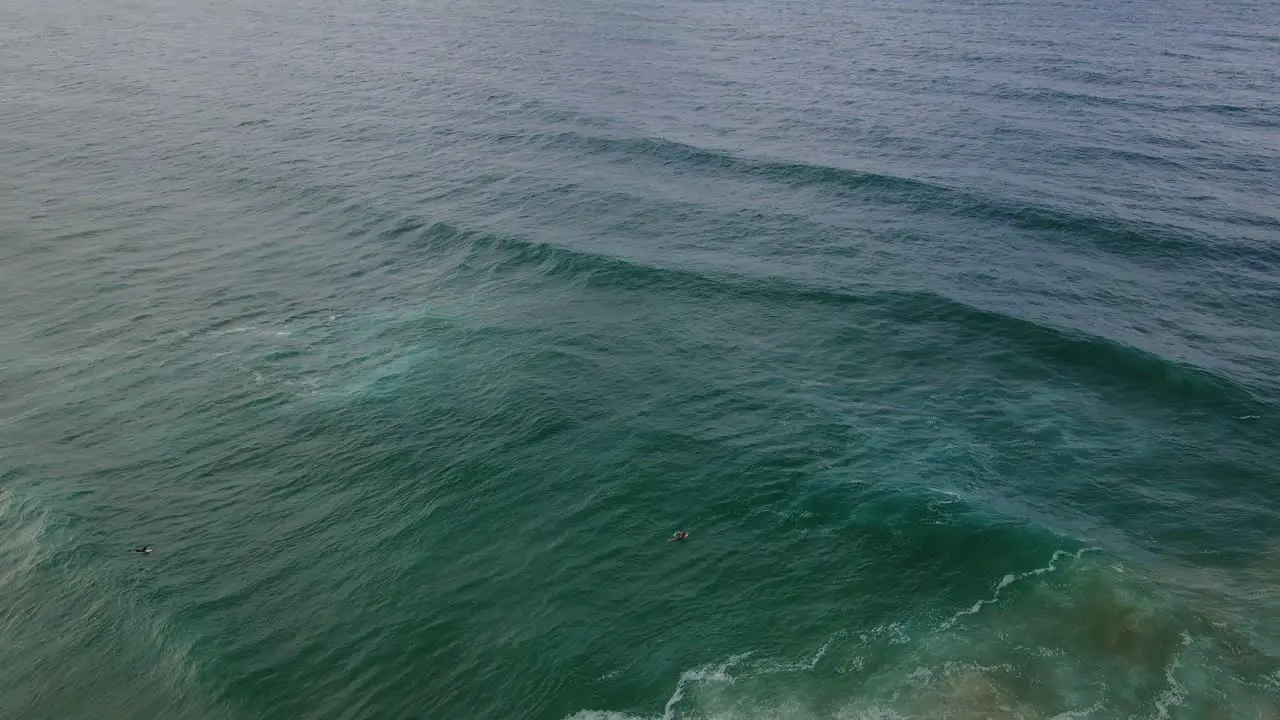 Sweeping Seascape With Surfers On Burleigh Heads Beach At Summertime In Gold Coast Queensland Australia