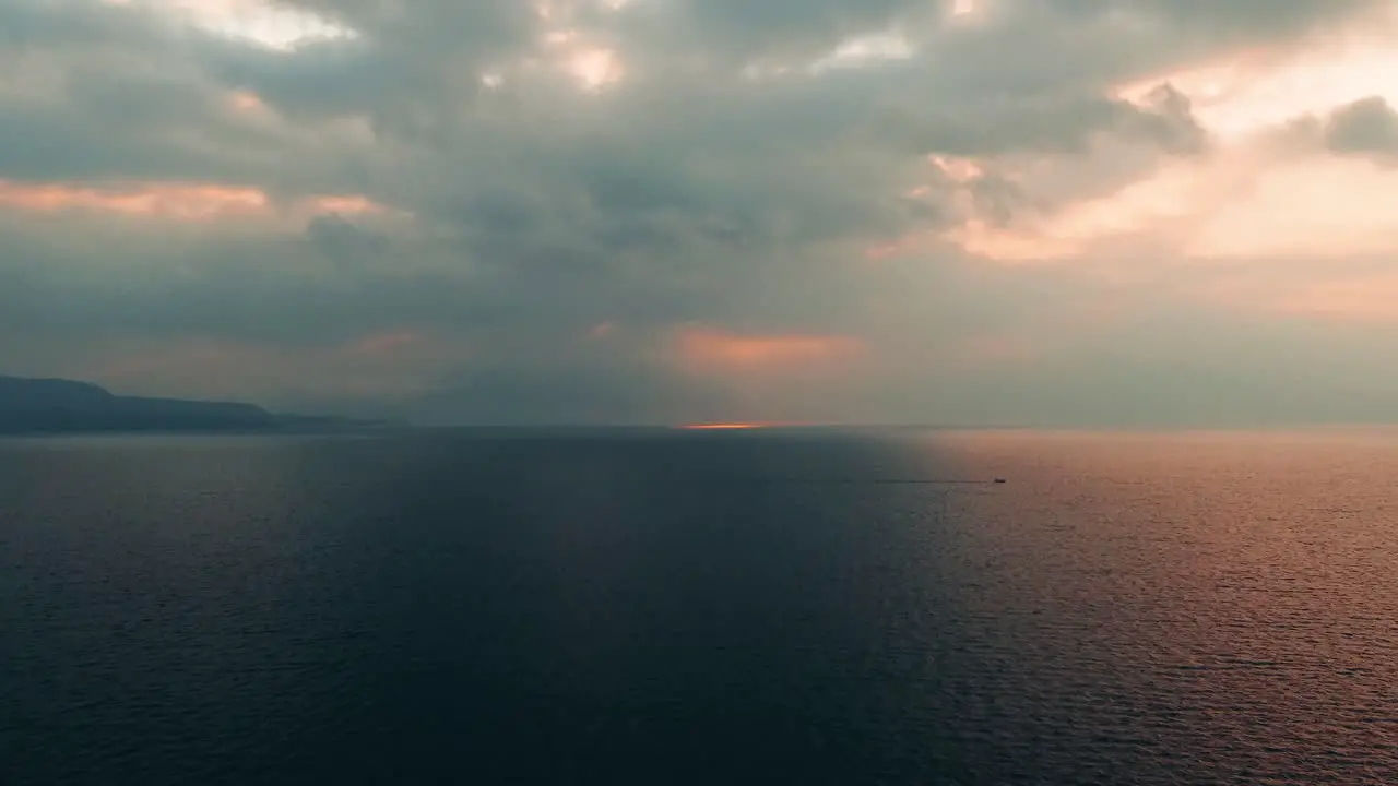 Flying over the calm sunset waves of Casa Palopo Guatemala -Time lapse