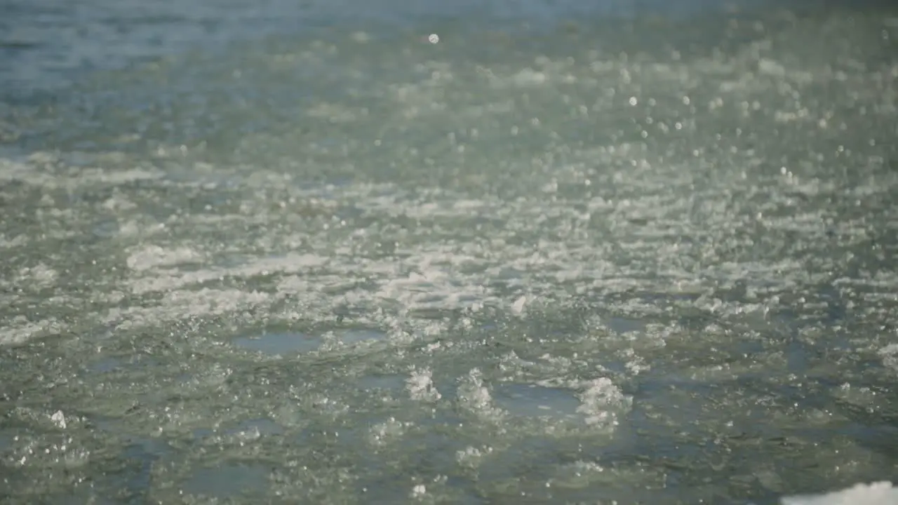 Ice Crystals Floating On A Semi Frozen Lake At Daytime