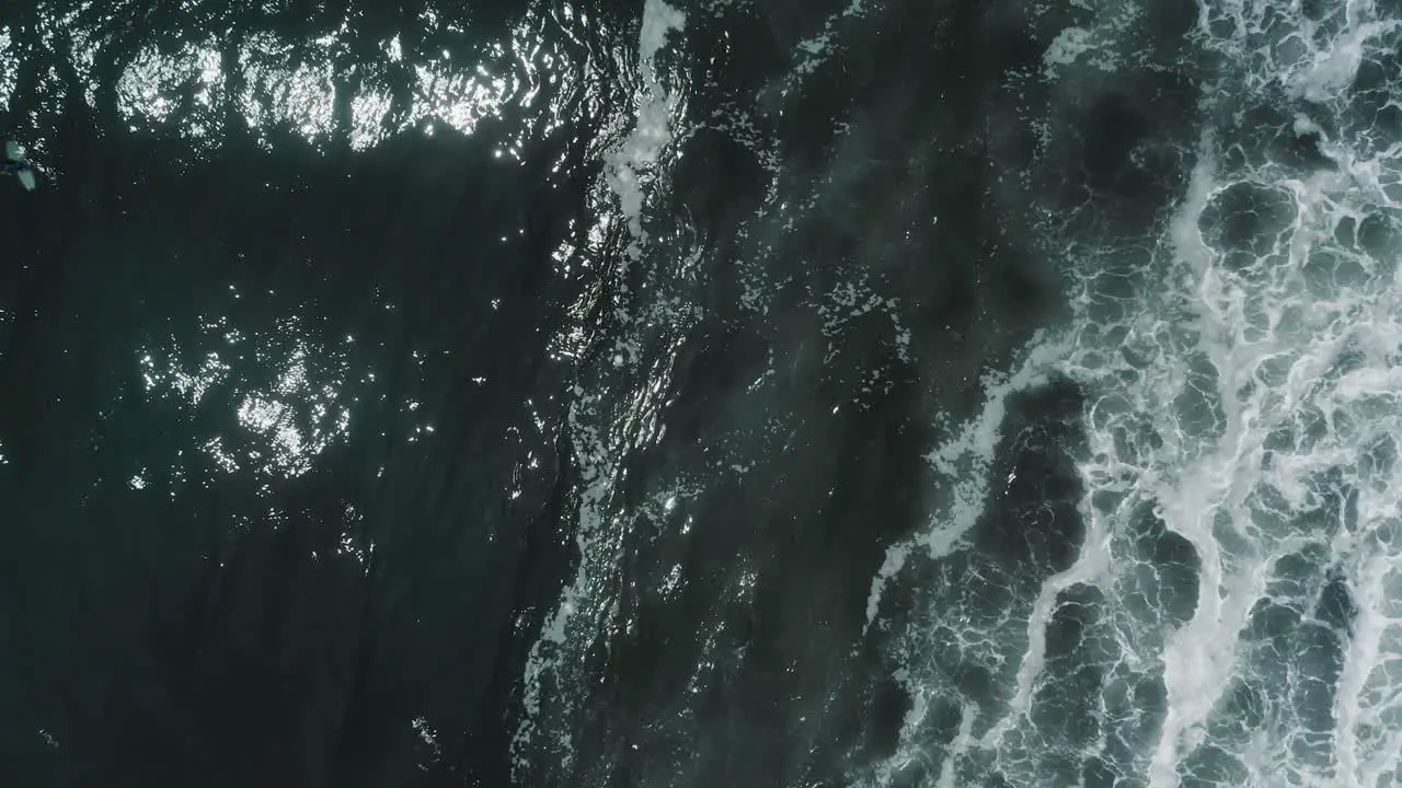 Glistening Waters Of Blue Sea With Foamy White Waves