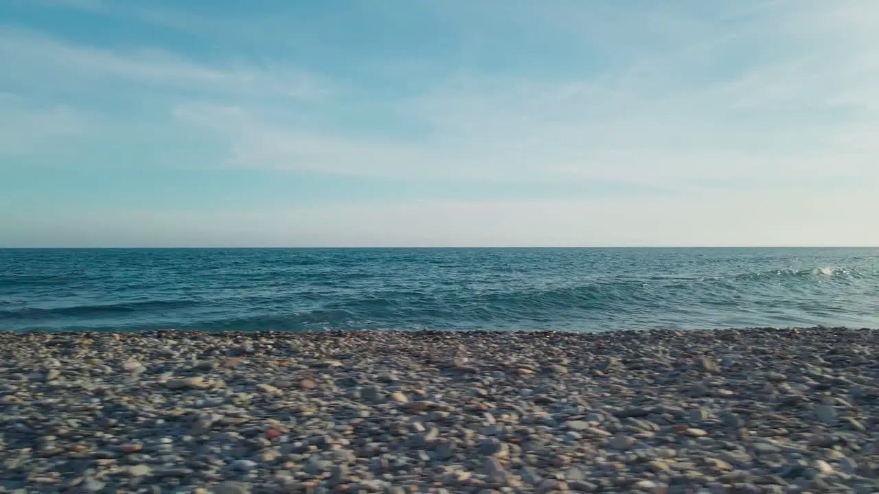 Moving sideways at an empty rocky beach