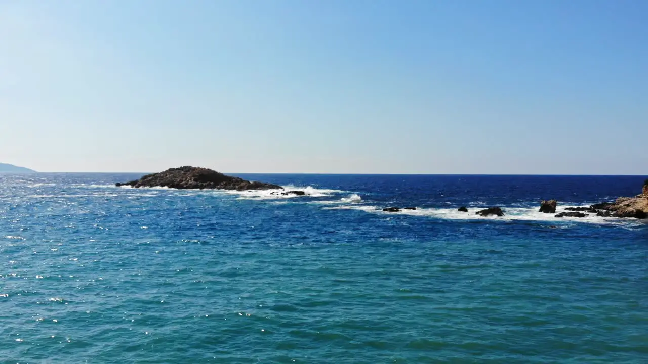 Small rock islands by Jerusalem Beach in Kefalonia -Wide slowmo