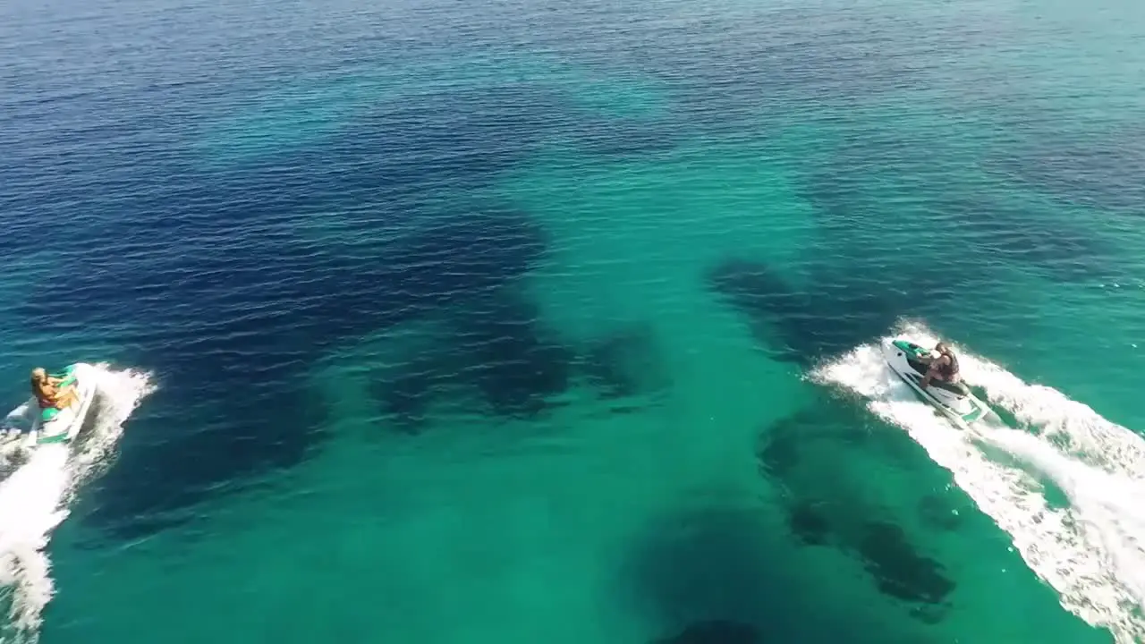 Jet Skiers Cruising in Bay