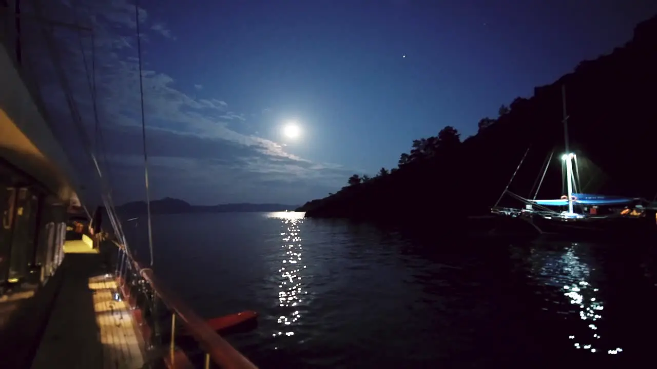 Full moon View reflecting in Mediterranean Sea from a boat at night Turkey Greece near Kos