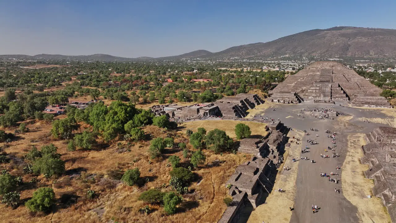 Teotihuacan Mexico Aerial v3 cinematic low level flyover avenue of the dead and leading to the historic landmark cultural heritage pyramid of the moon Shot with Mavic 3 Cine December 2021