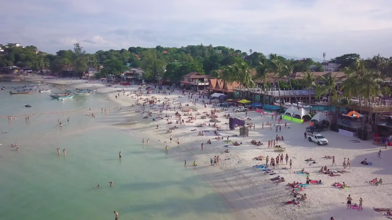 Aerial Flyby of Haad Rin Beach After Full Moon Party Koh Phangan Island Thailand