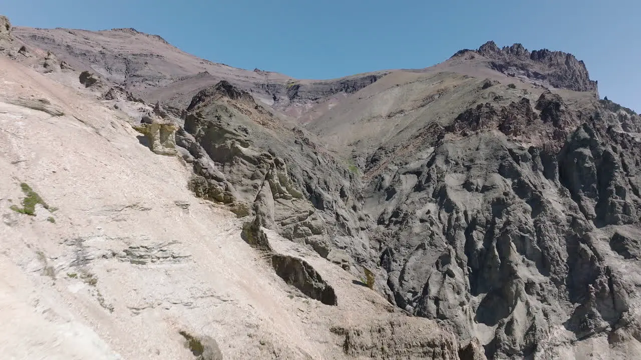 Aerial Dolly Back Dry Craggy Cliffside Edge Landscape Near Cerro Castillo