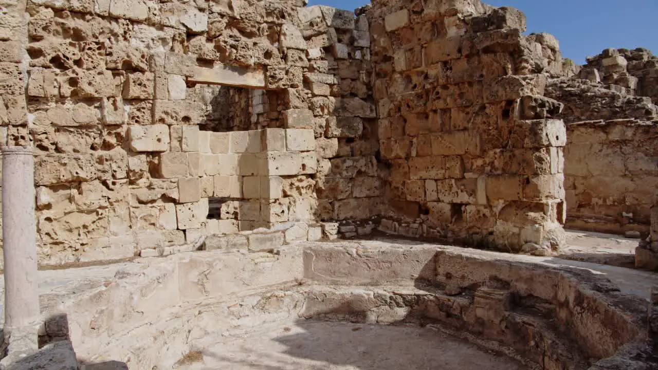 Ancient limestone pool without water in city of Salamis Cyprus