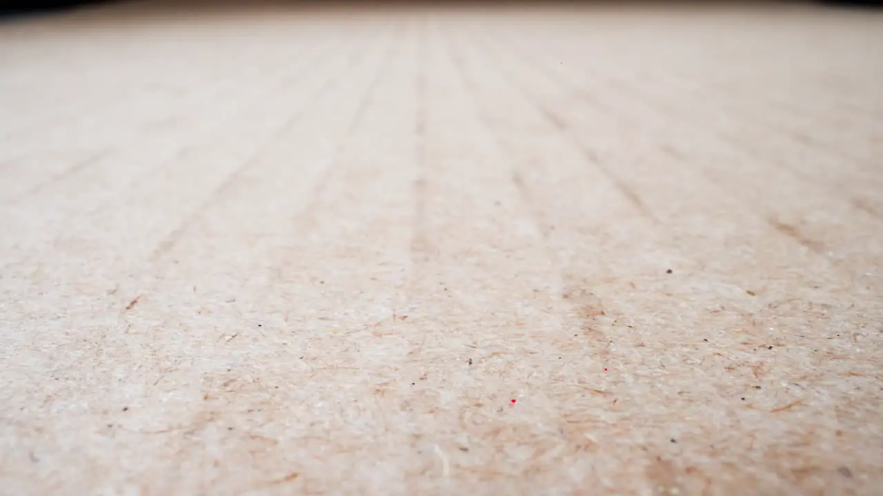 Motion along large blank brown cardboard sheet macro