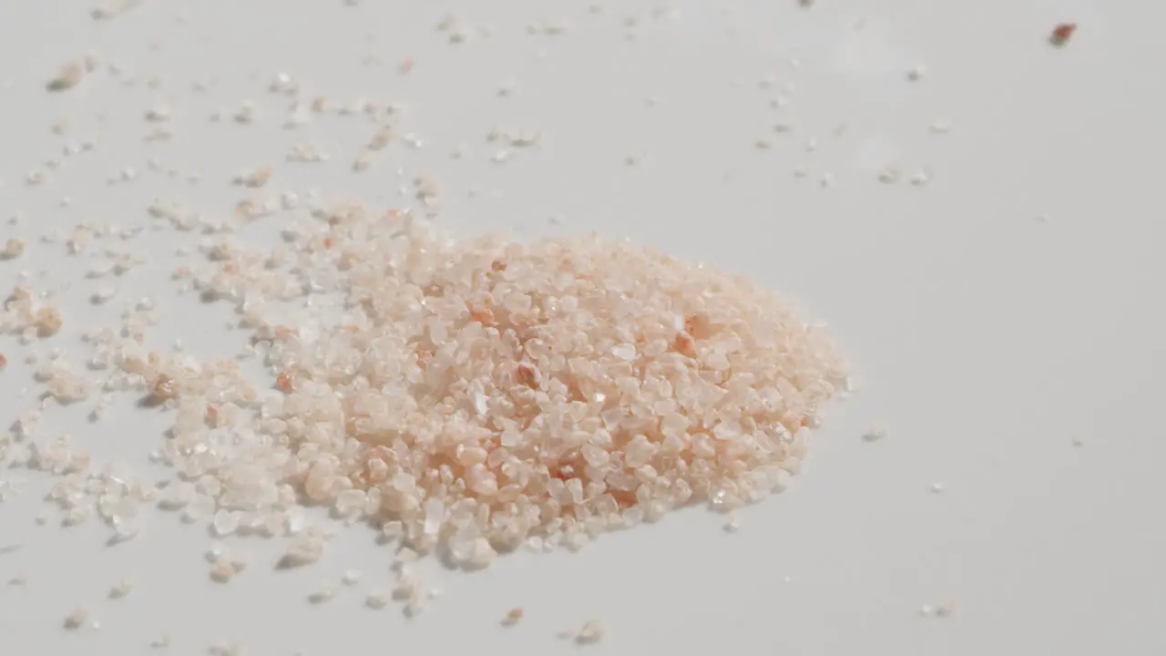 Sprinkling himalayan salt onto a table