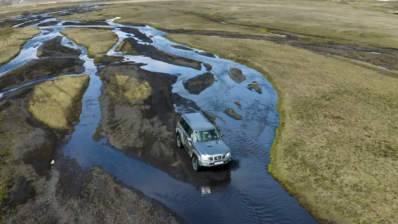 A drone video following a modified 4x4 truck in the highlands of Iceland