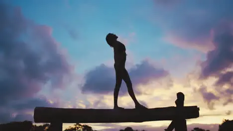 Silhouette fitness and woman on balance beam