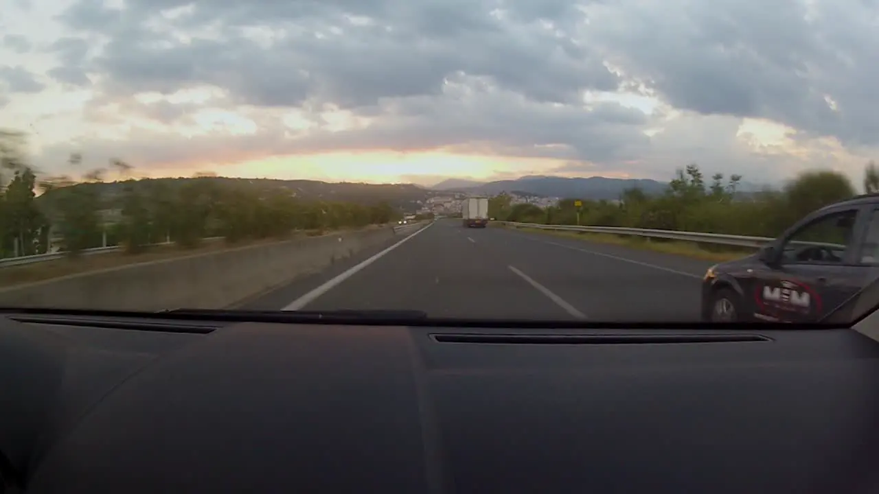 Beautiful sunset and mountain line while driving on the autobahn between Thessaloniki and Ioannina in the northwest region of Greece through the Pindos mountains