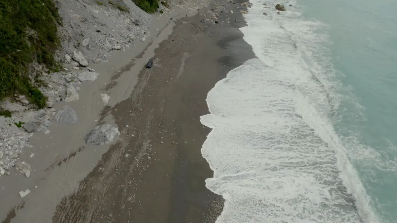 Aerial view above sandy coast tilting to Qingshui cliffs Taroko gorge Hualien County Taiwan