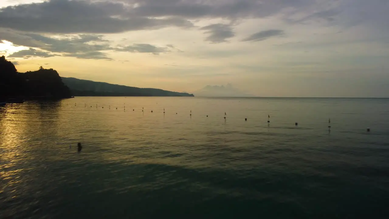 Man running on the shoreline on a sunrise