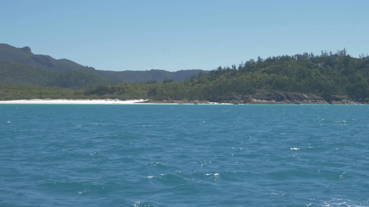 Beautiful bright blue waves by the South Whitehaven Beach in Queensland Australia -Slowmo