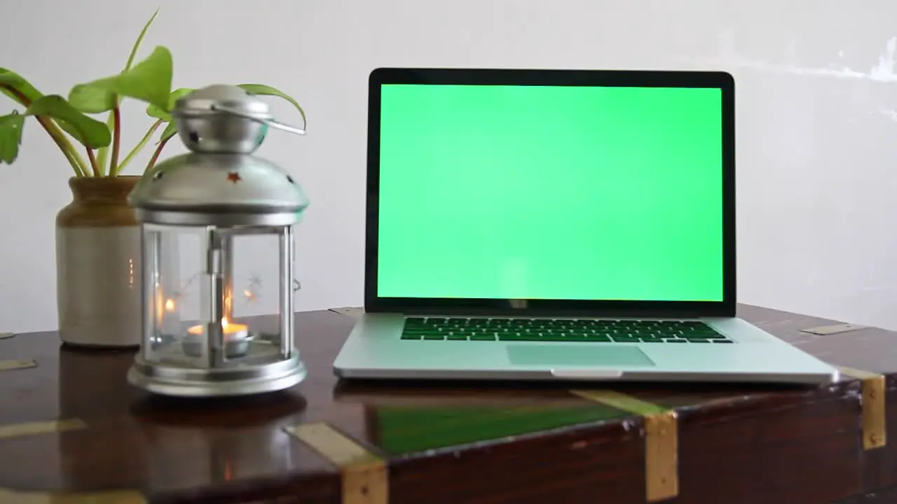 A laptop with a green screen which can be removed to place any content as per the requirement