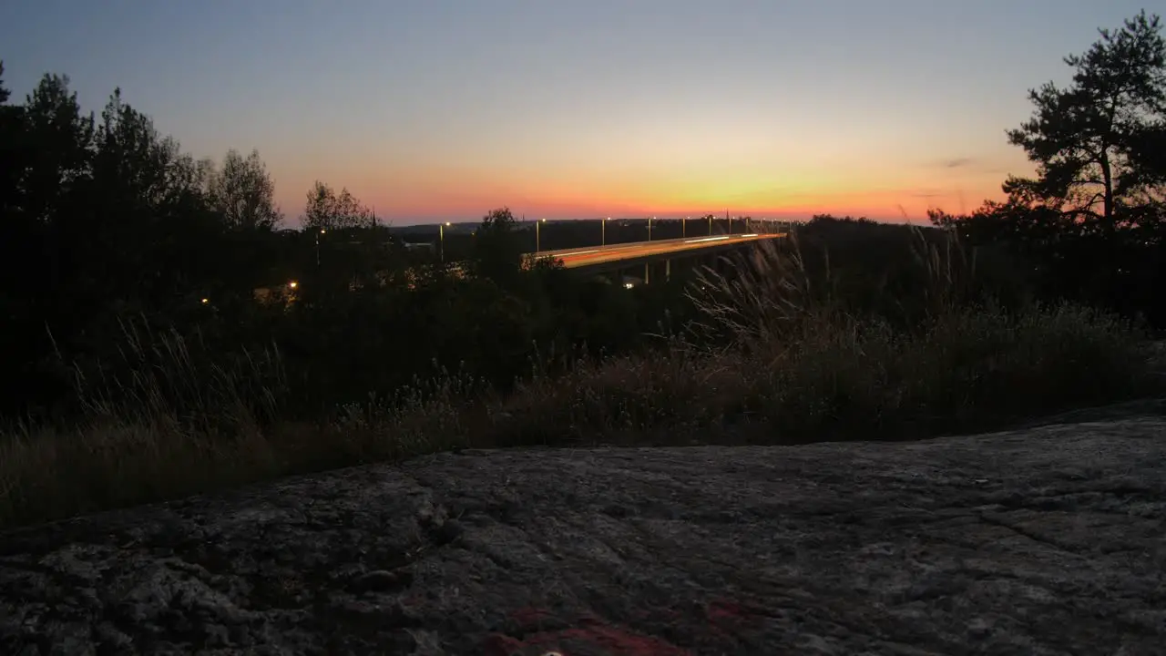 Time lapse of a sunset captured on a hill in Liljeholmen in Stockholm facing the motor highway Essingeleden