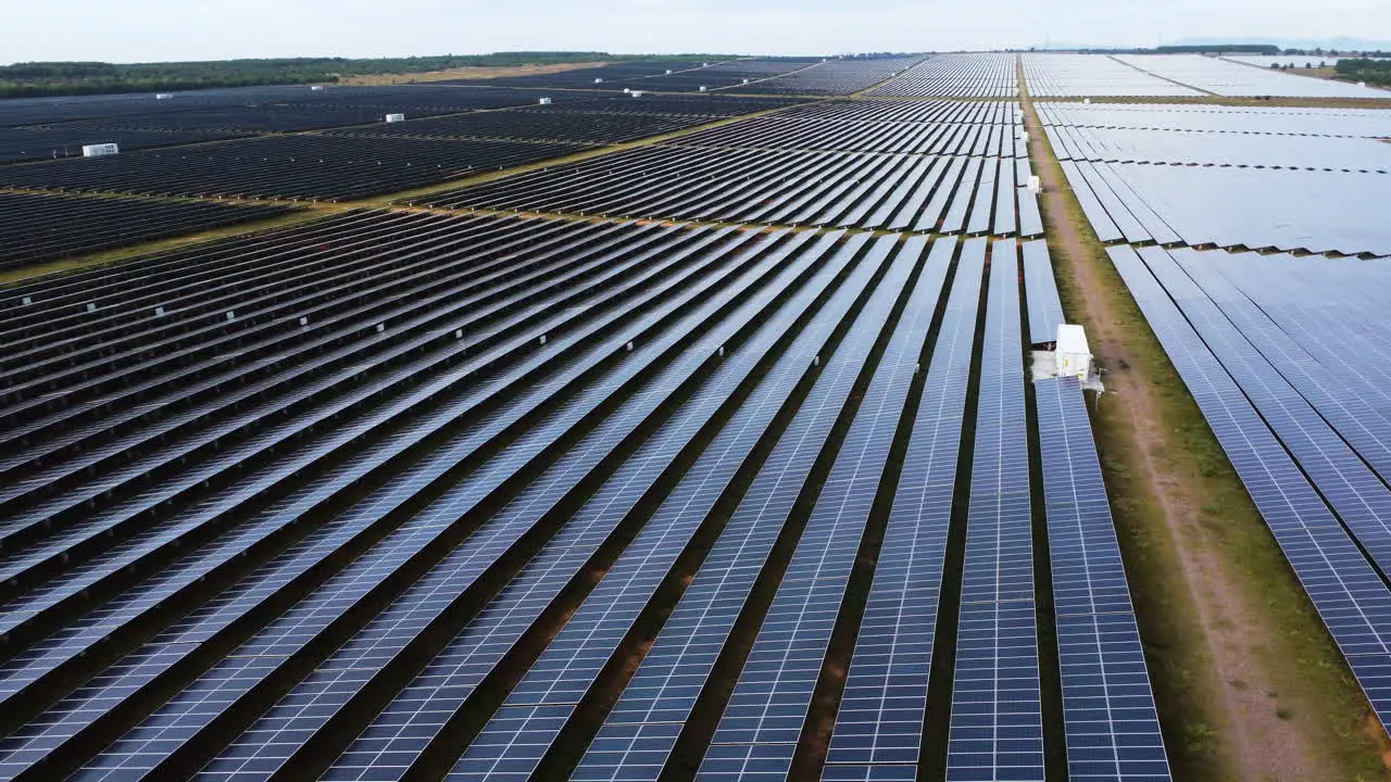 Aerial panorama solar panel farm field generating renewable sustainable energy